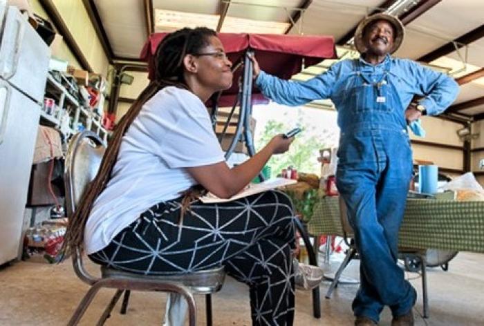 Andrea Roberts interviewing Richard Johnson about Jasper County freedom colonies. Photo by Richard Orton.