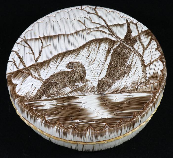 A quill box featuring otters made by Yvonne Walker Keshick using all natural quills. Image courtesy of MSU Museum collections, ID 2017:24.108. Photo by Pearl Yee Wong.