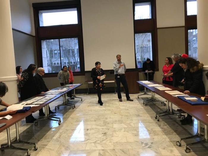 Native community members view collection items at a community meal held at the Newberry Library in January 2020 to discuss the Indigenous Chicago project